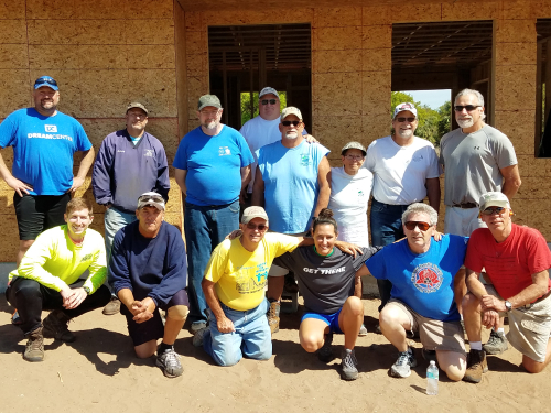 group posing for photo outside